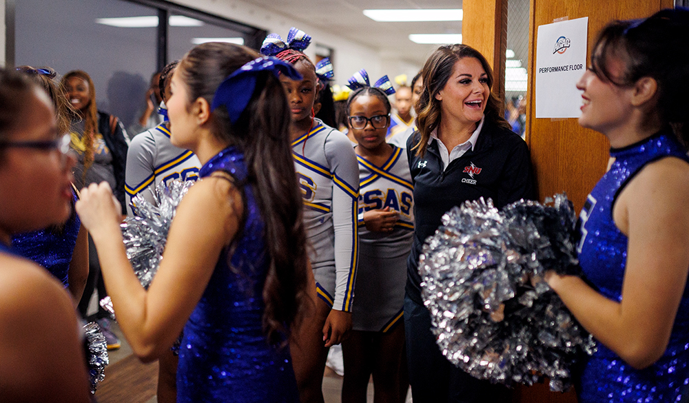 cheer coach with students